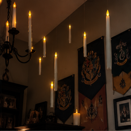 Floating candles near a chandelier